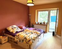 Schlafzimmer mit Balkonzugang